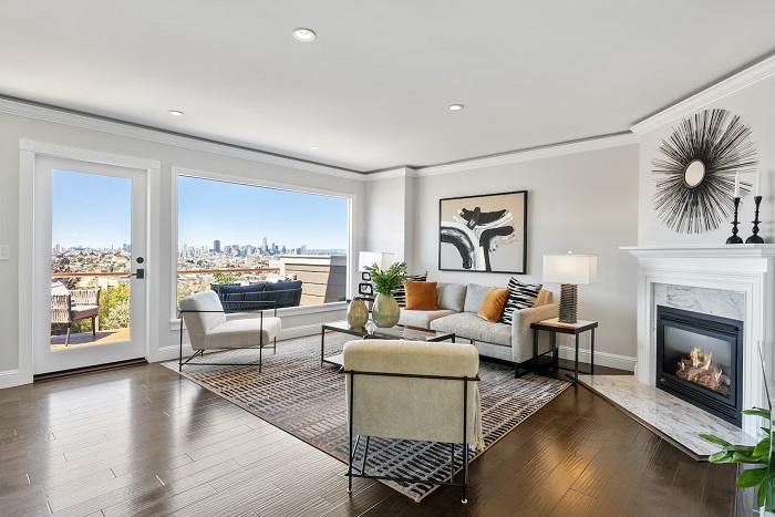 Apartment living room with big windows and a city view