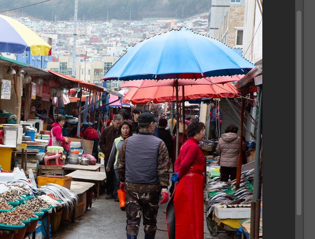image of korean market with blue umbrella