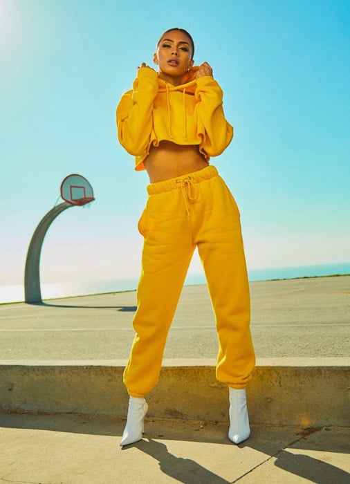 A street fashion shot of a femal model posing outdoors - fashion photography types
