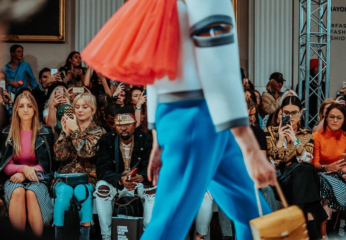 A model walking the catwalk during a fashion show 