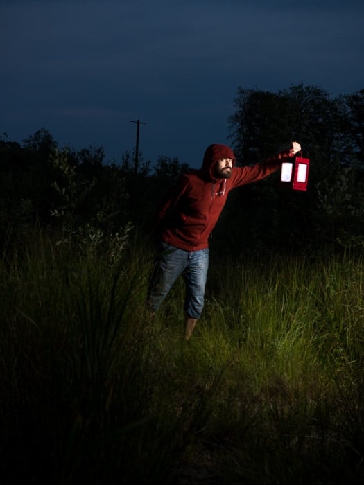 Portrait lighting: night portrait of a male model balancing flash and ambient light outdoors