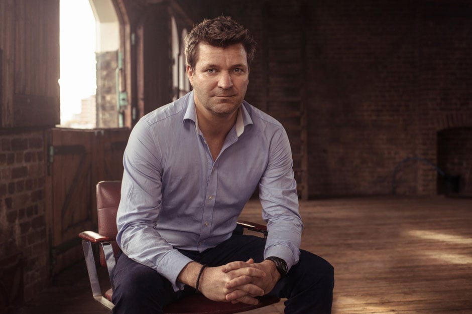 Portrait of a man sitting indoors shot with loop lighting for creative lighting ideas