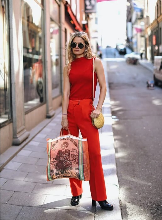 Blond woman wearing red in a city street