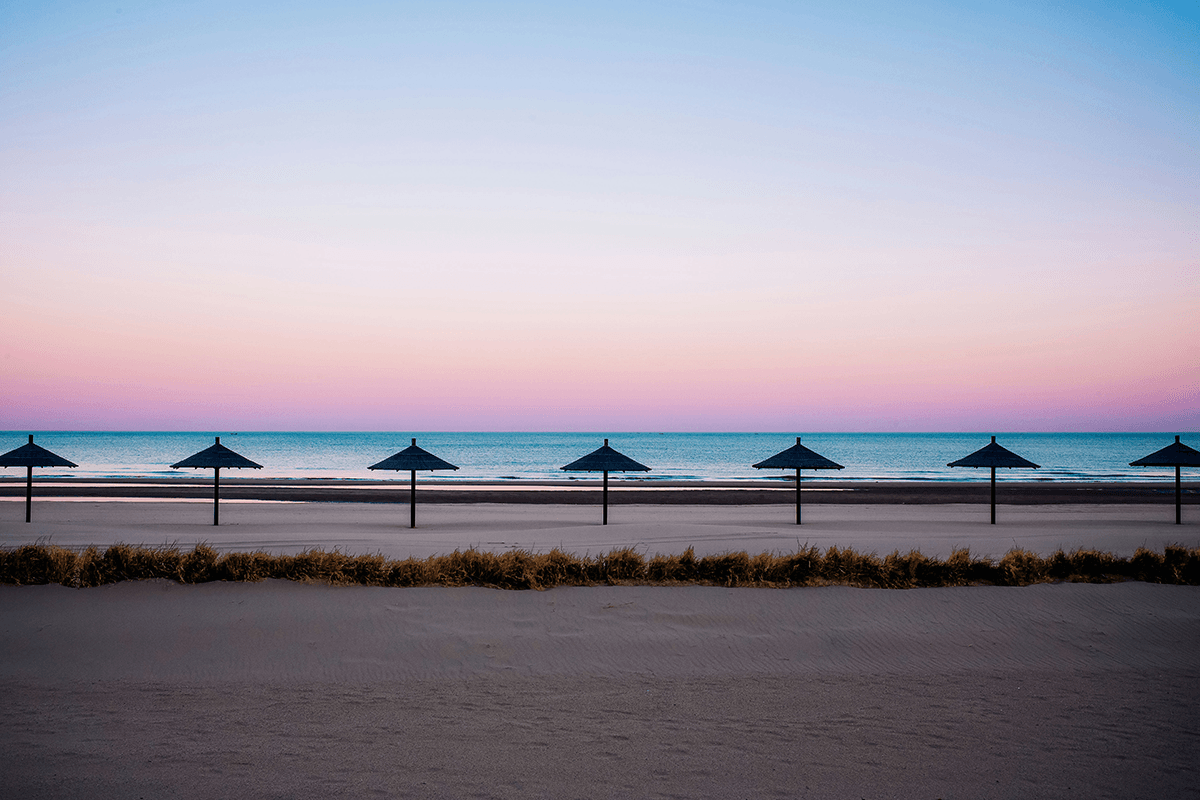 Symmetrical beach umbrellas showing visual weight